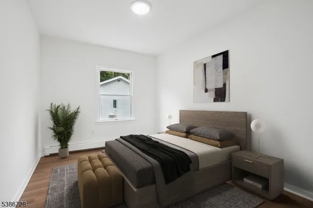 a bedroom with furniture and a window