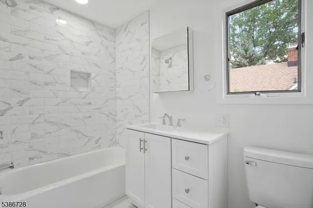 a view of play room with toys and entryway