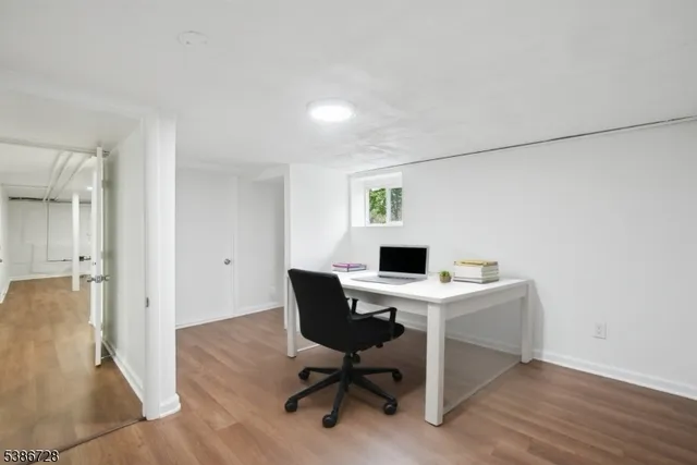 a view of bathroom with a toilet sink and mirror