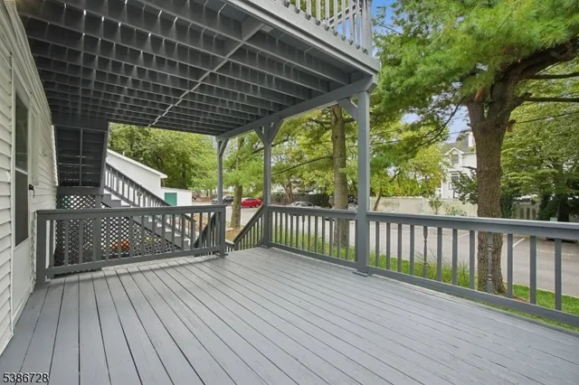 a view of backyard with a deck