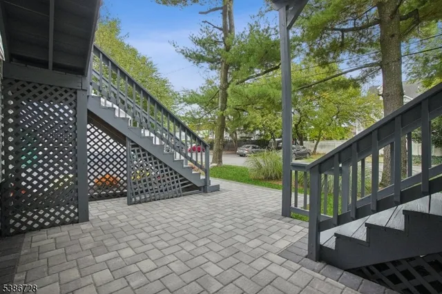 a view of a house with a yard and garage
