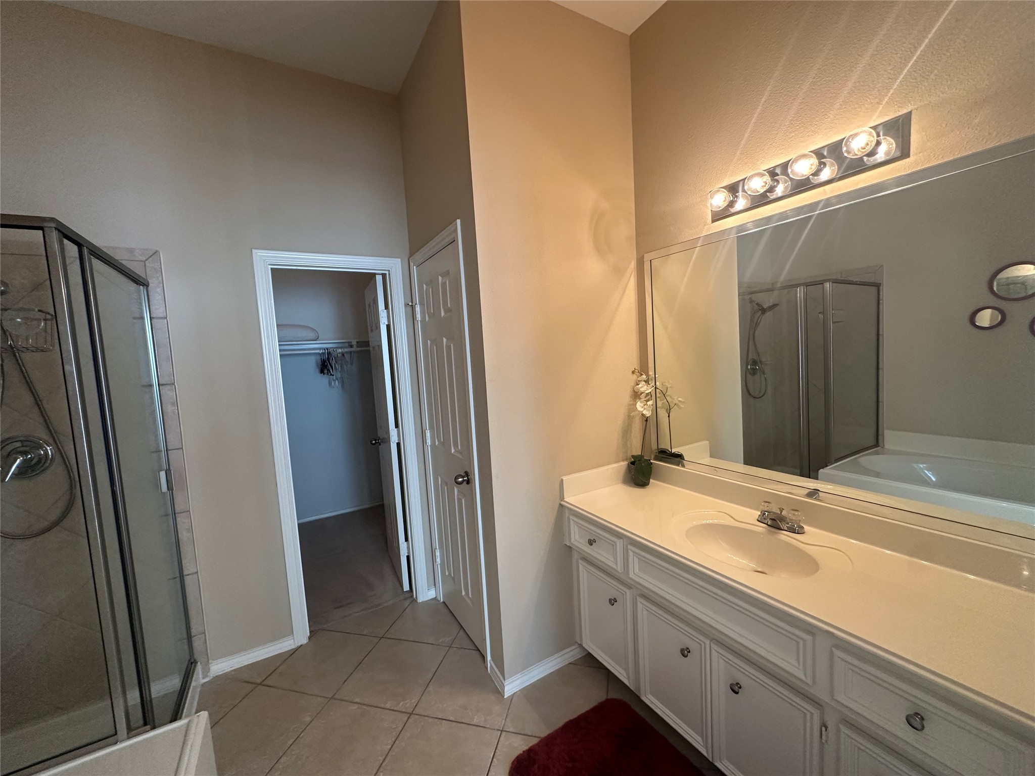 14943 Atmore Pl Drive Houston, TX 77082 - Photo 6 of 10 a bathroom with a double vanity sink and a mirror