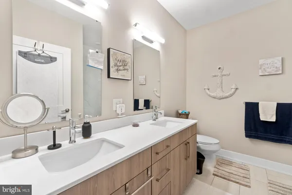 a bathroom with a sink double vanity and a mirror