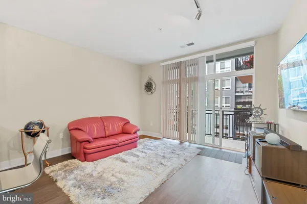 a bedroom with furniture and natural light