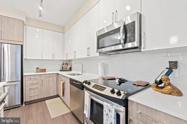 a kitchen with a stove and a refrigerator