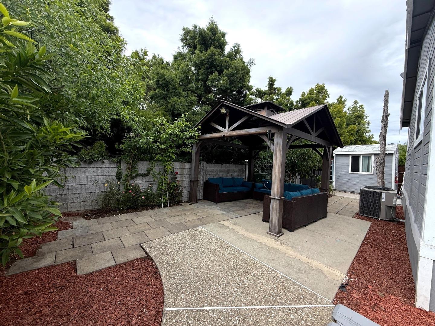 6130 Monterey Road, Unit 22 San Jose, CA 95138 - Photo 17 of 21 a view of a house with yard and sitting area