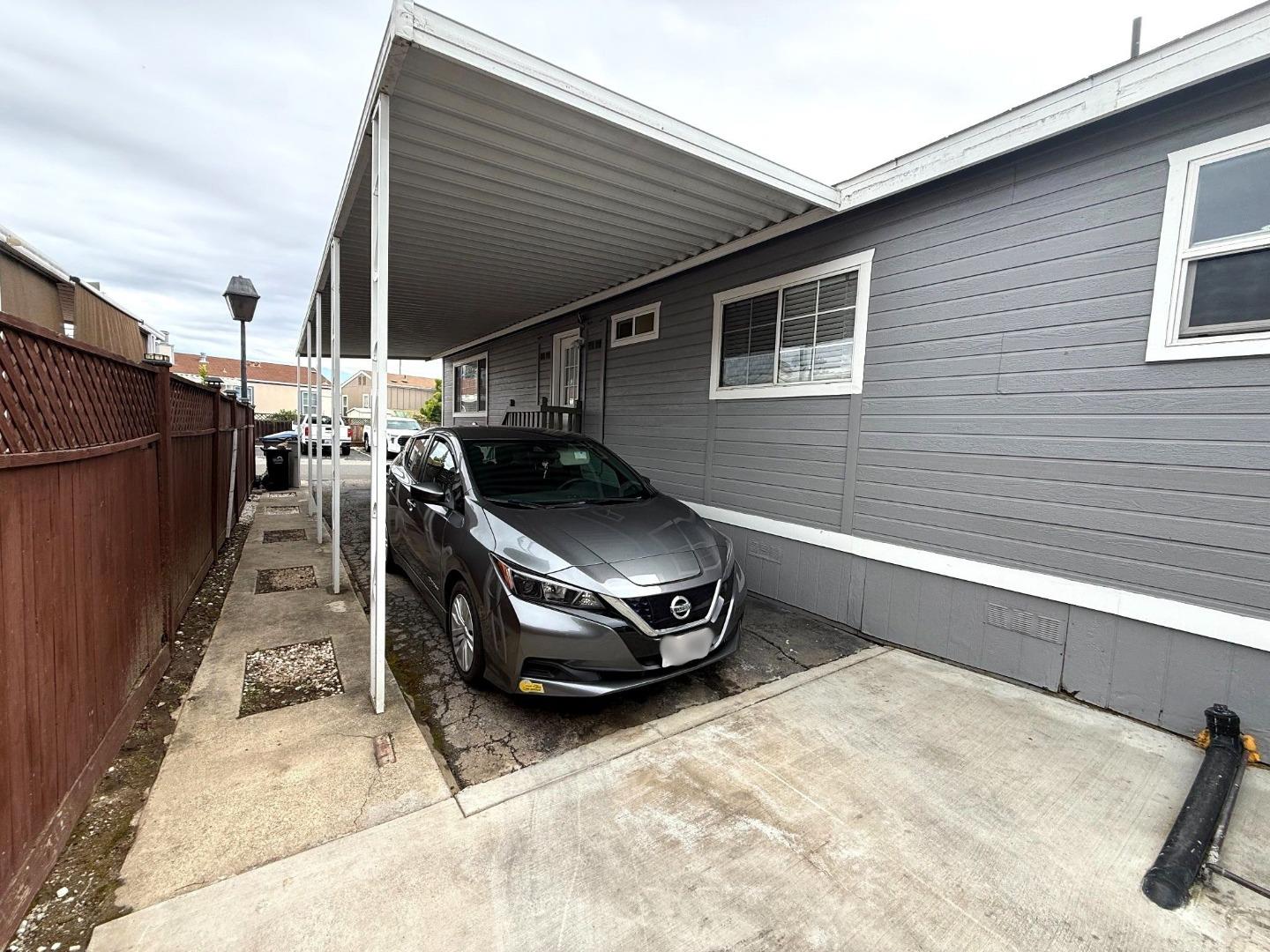 6130 Monterey Road, Unit 22 San Jose, CA 95138 - Photo 21 of 21 a car parked in front of a house