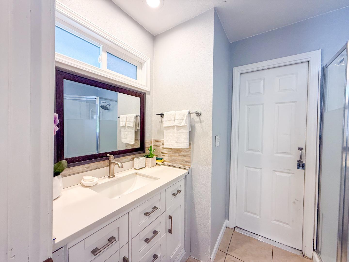 6130 Monterey Road, Unit 22 San Jose, CA 95138 - Photo 8 of 21 a bathroom with a double vanity sink mirror and