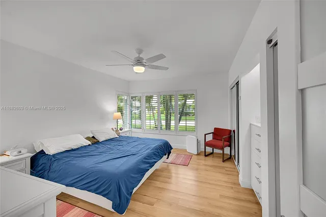 a bed room with a bed and a chair