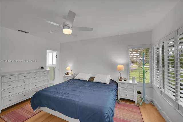 a bed room with a bed and a window