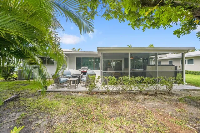 a front view of a house with a garden and porch