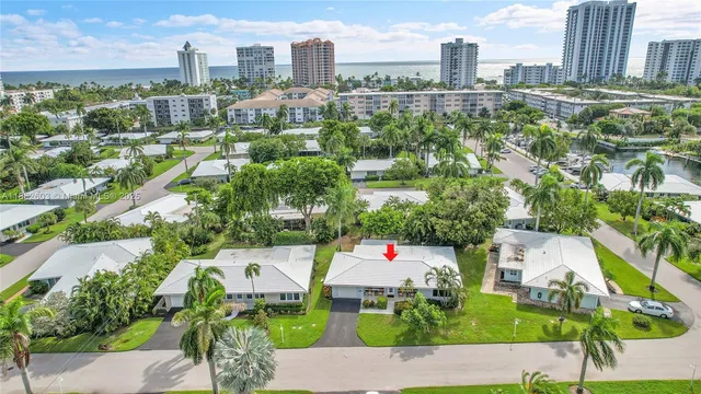 an aerial view of residential houses with outdoor space and street view