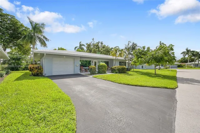 a swimming pool with outdoor seating and yard
