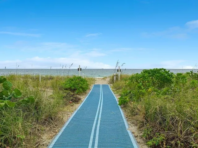 a view of a swimming pool with a house
