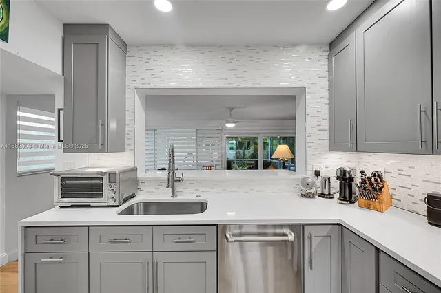 a kitchen with a sink and cabinets