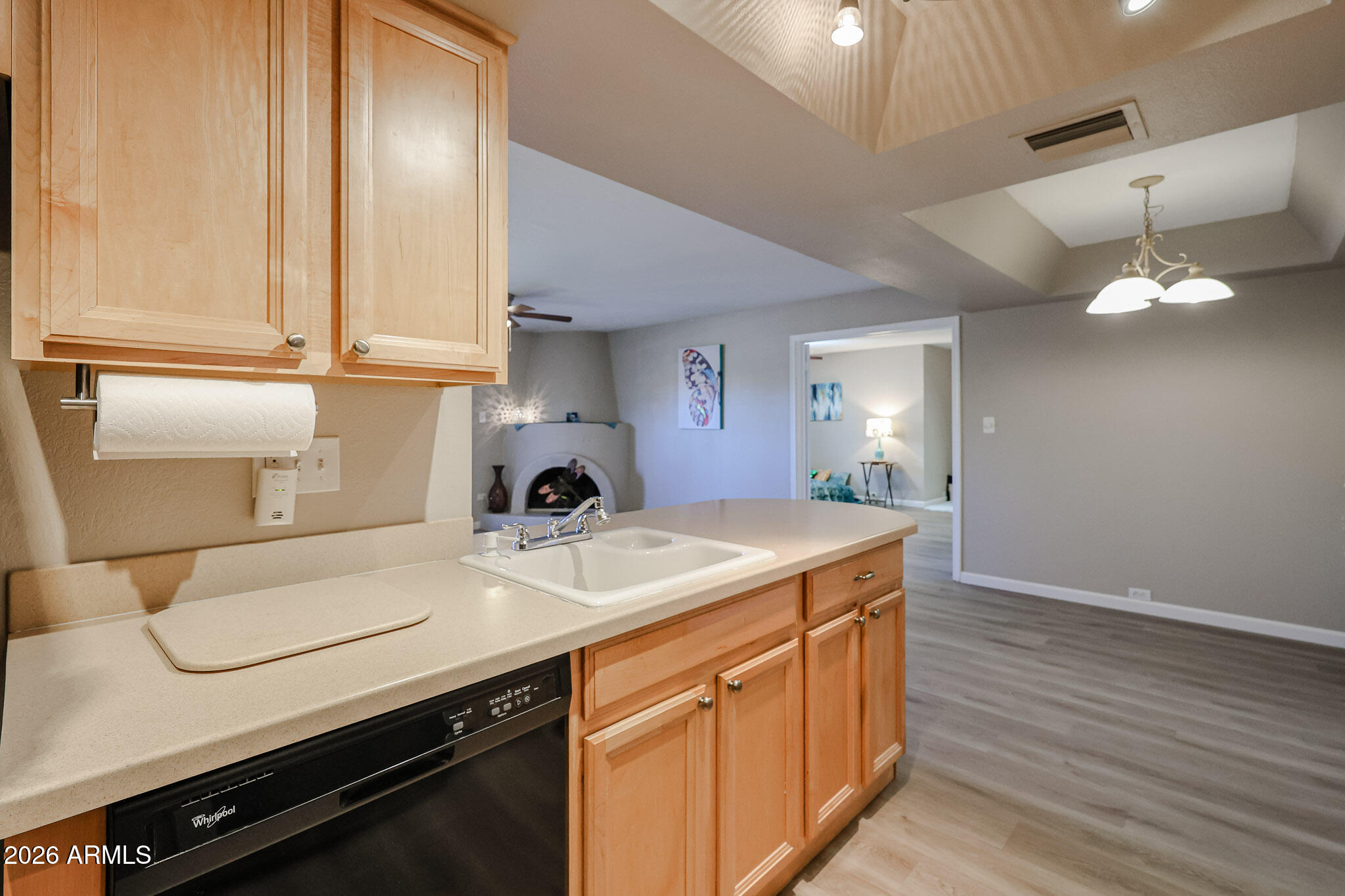 10410 North Cave Creek Road, Unit 1011 Phoenix, AZ 85020 - Photo 12 of 54 a kitchen with a sink and wooden floor