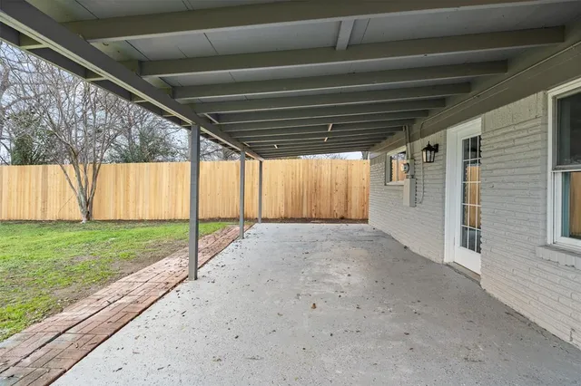 a view of a backyard of the house