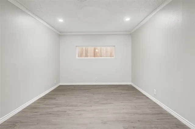 wooden floor in a hall with a window