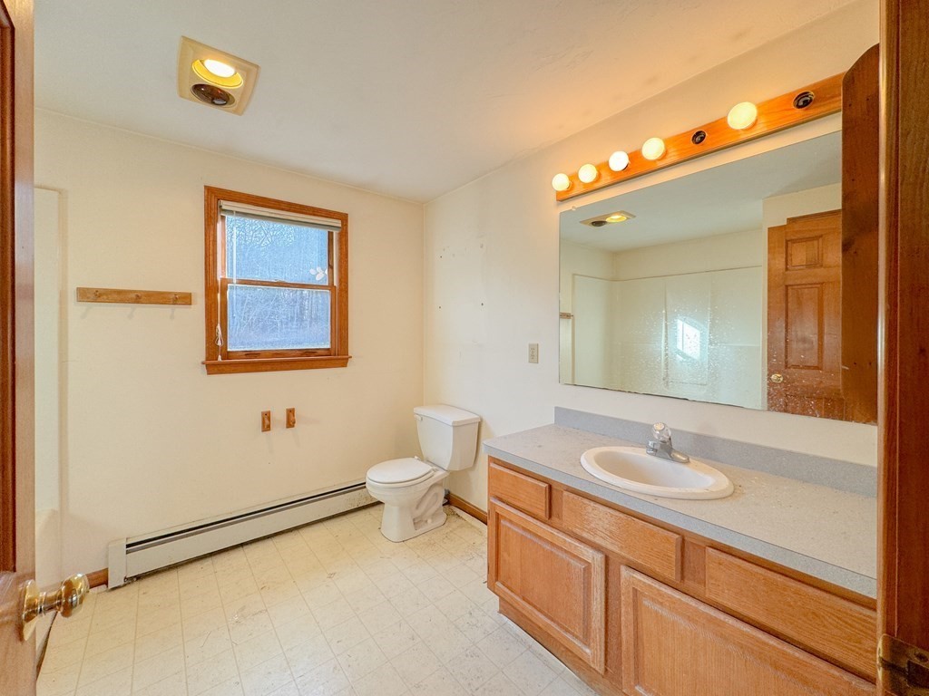 29 Thurston Hill Road Rutland, MA 01543 - Photo 23 of 38 a bathroom with a sink a toilet and mirror