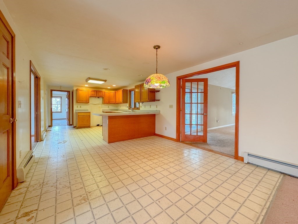 29 Thurston Hill Road Rutland, MA 01543 - Photo 25 of 38 a view of a kitchen with furniture and a chandelier