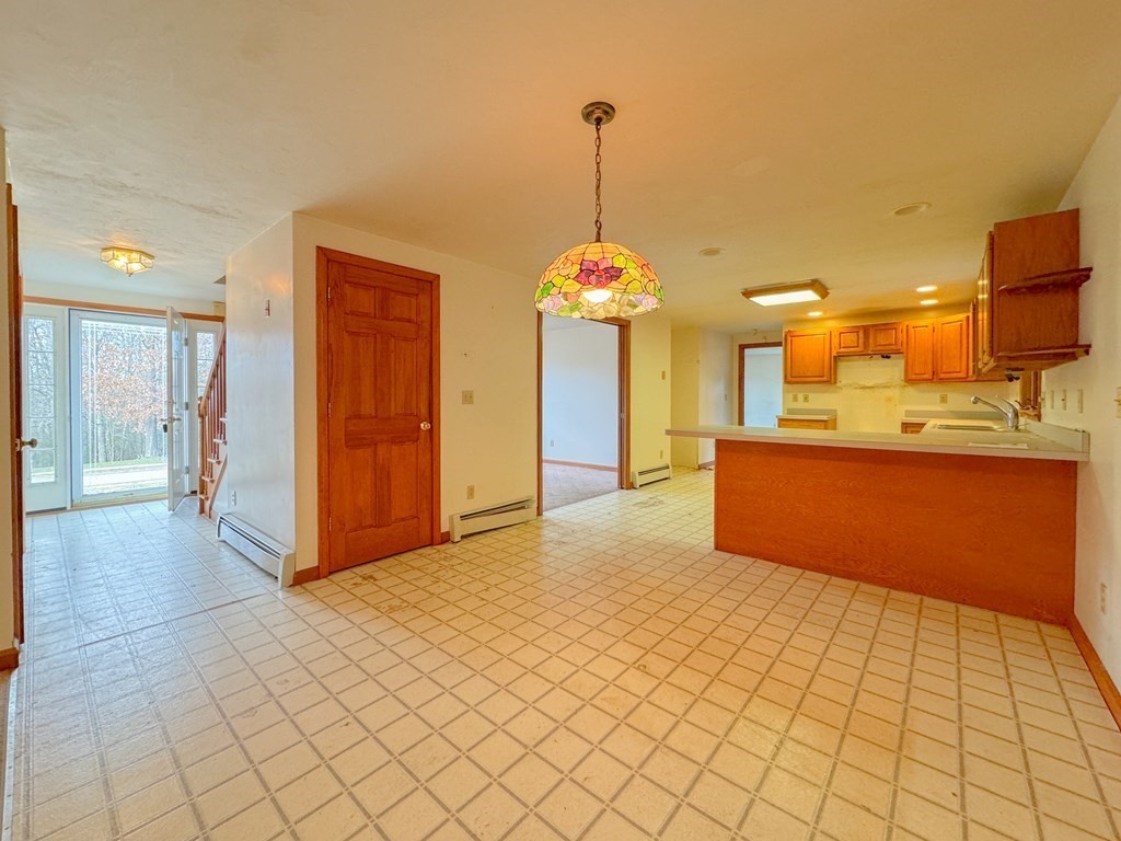 29 Thurston Hill Road Rutland, MA 01543 - Photo 26 of 38 a view of a kitchen with a refrigerator