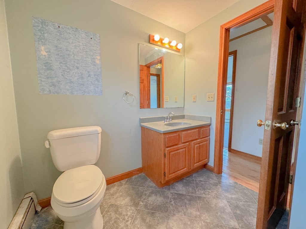 29 Thurston Hill Road Rutland, MA 01543 - Photo 31 of 38 a bathroom with a toilet sink and mirror