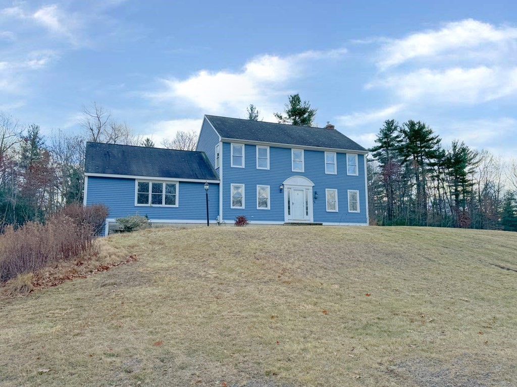 29 Thurston Hill Road Rutland, MA 01543 - Photo 36 of 38 a front view of a house with a yard and garage