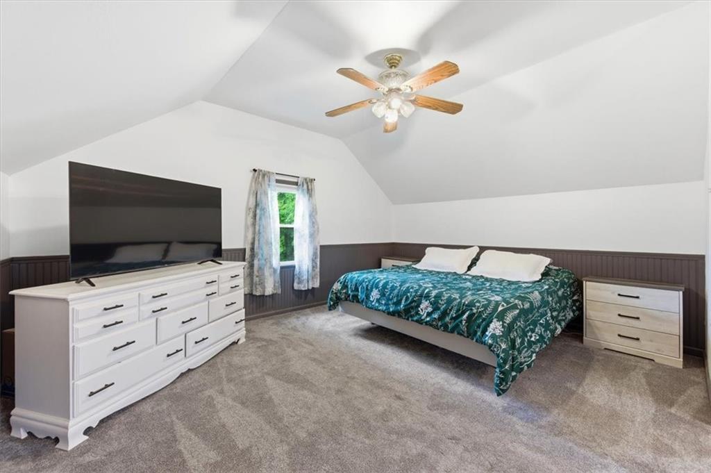 344 Winfield Road Cabot, PA 16023 - Photo 19 of 30 a bedroom with furniture and a flat screen tv