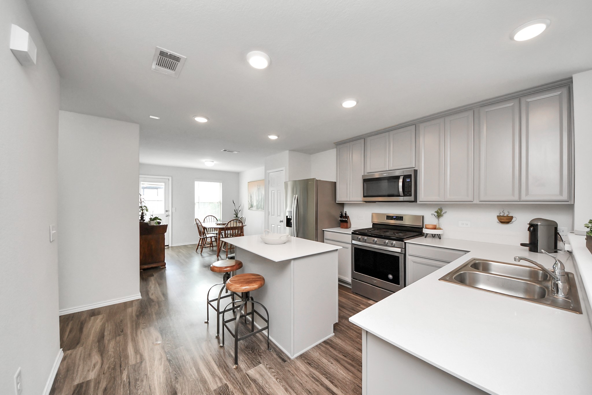 5722 Savanna Pasture Road Katy, TX 77493 - Photo 12 of 40 Chef’s Delight! This open-concept kitchen features premium granite countertops, a massive island, and stainless steel appliances