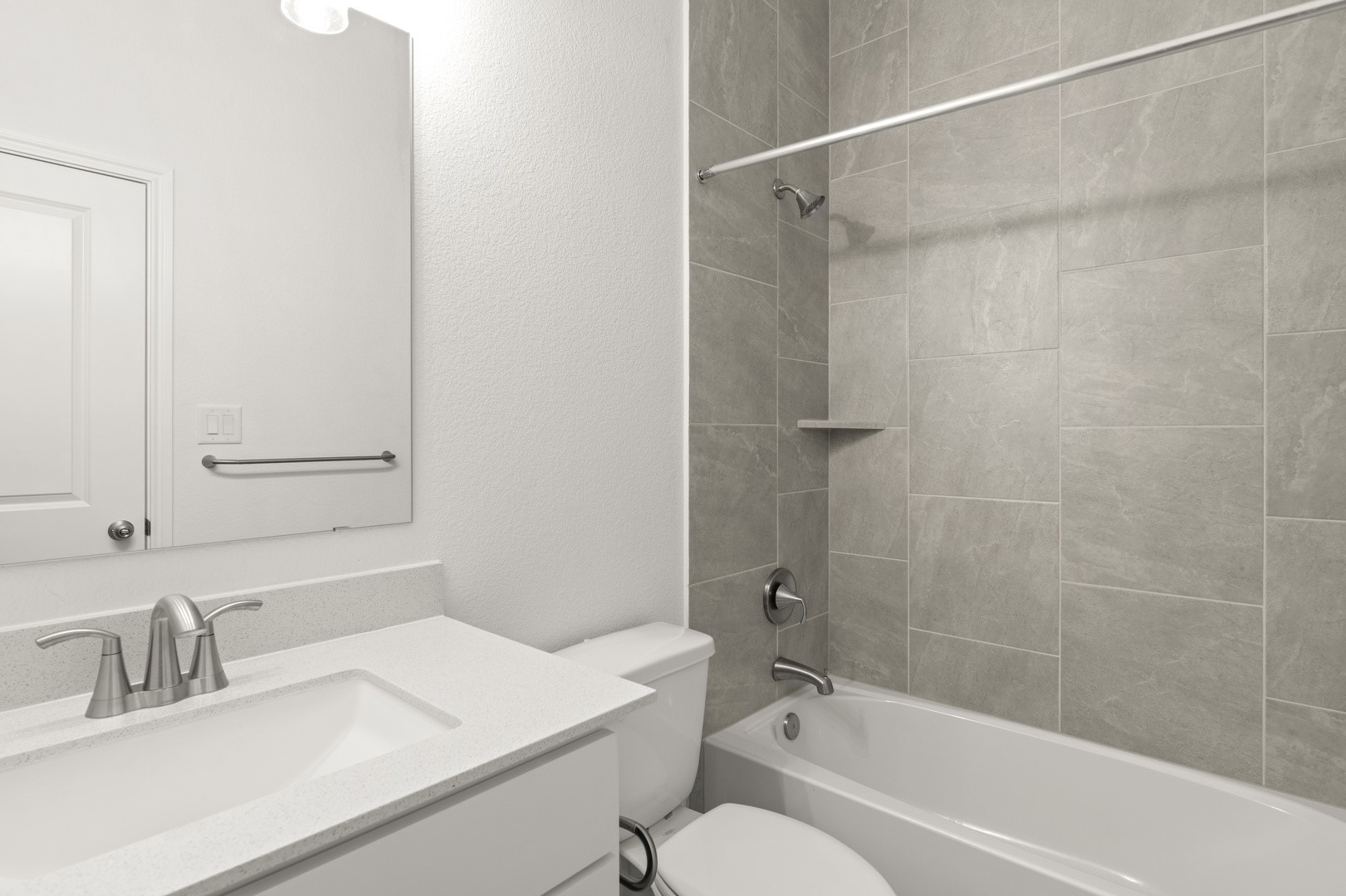 3729 Pin Oak Hills Seguin, TX 78155 - Photo 18 of 22 Bathroom featuring shower / bath combination, vanity, and a textured wall