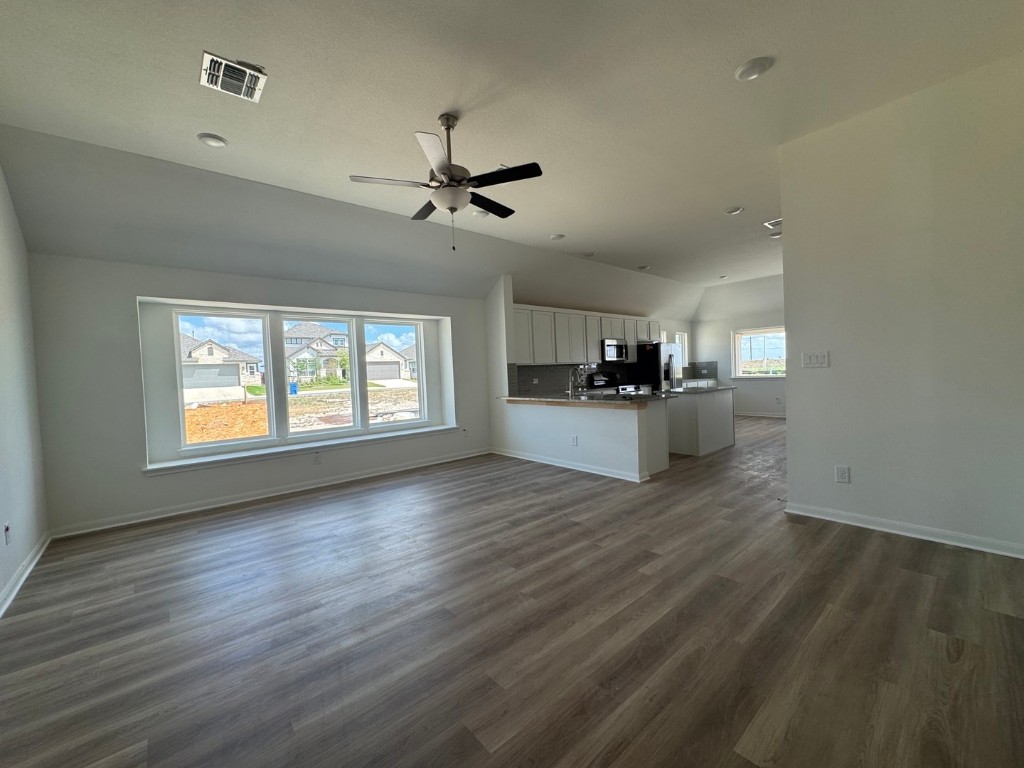 3729 Pin Oak Hills Seguin, TX 78155 - Photo 3 of 19 a view of a kitchen with a sink cabinets wooden floor and a kitchen