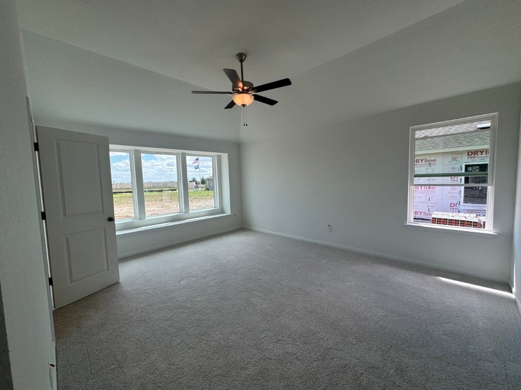 3729 Pin Oak Hills Seguin, TX 78155 - Photo 7 of 19 an empty room with windows and fan