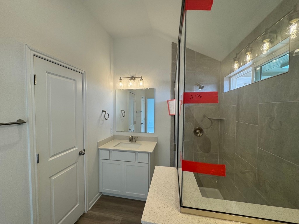 3729 Pin Oak Hills Seguin, TX 78155 - Photo 8 of 19 a bathroom with a shower sink and mirror