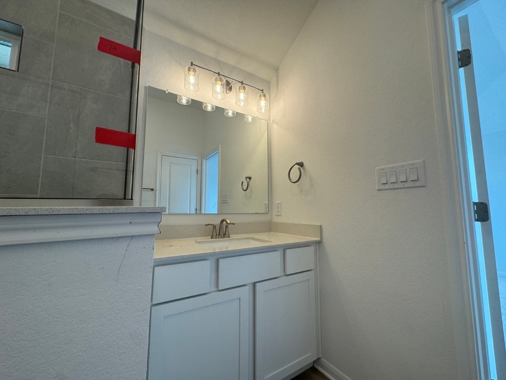 3729 Pin Oak Hills Seguin, TX 78155 - Photo 9 of 19 a bathroom with a sink and a mirror