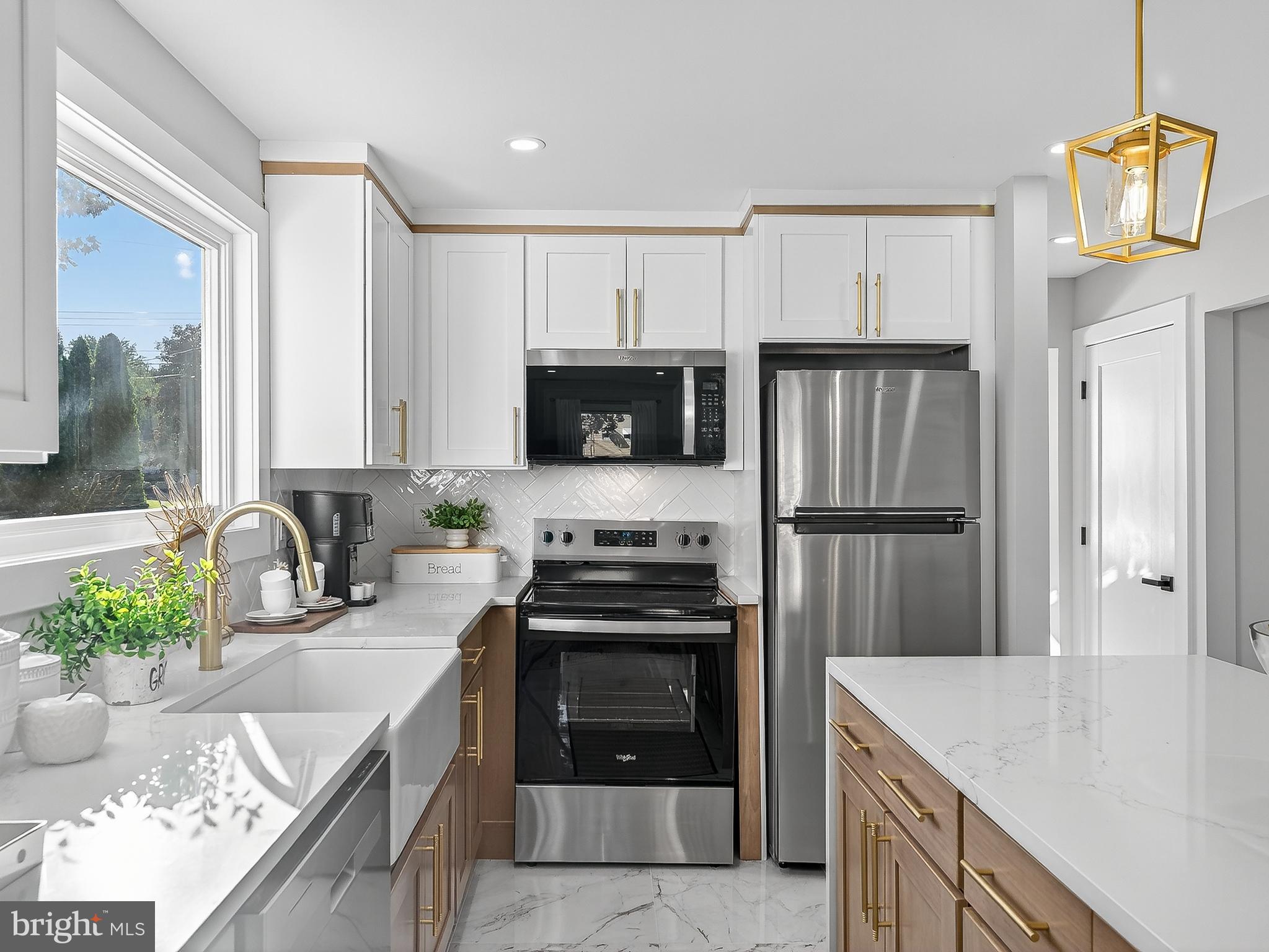 16 Estate Road Pemberton, NJ 08068 - Photo 13 of 40 a kitchen with a stove a sink and a refrigerator