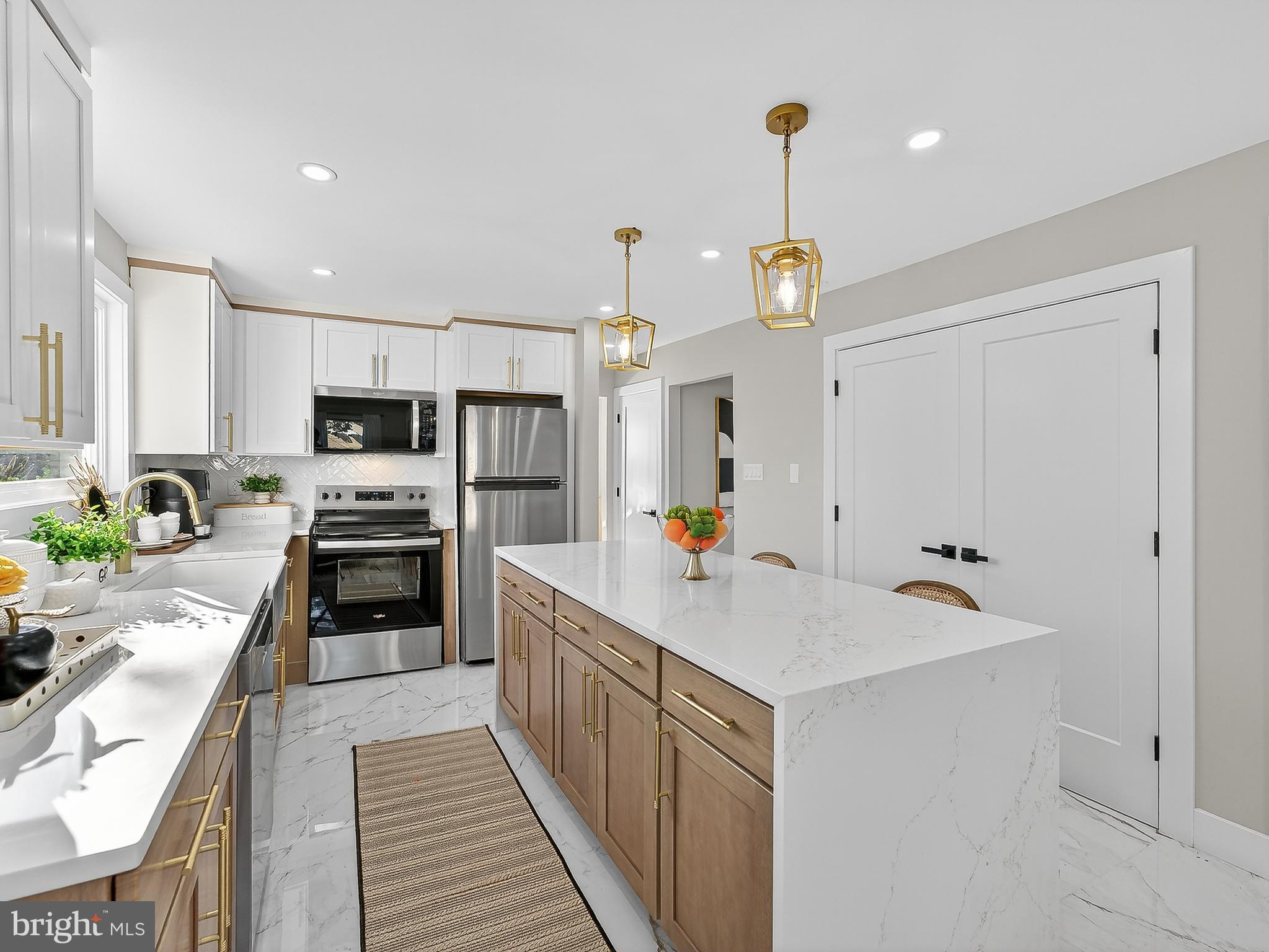 16 Estate Road Pemberton, NJ 08068 - Photo 15 of 40 a kitchen with a sink stove and refrigerator