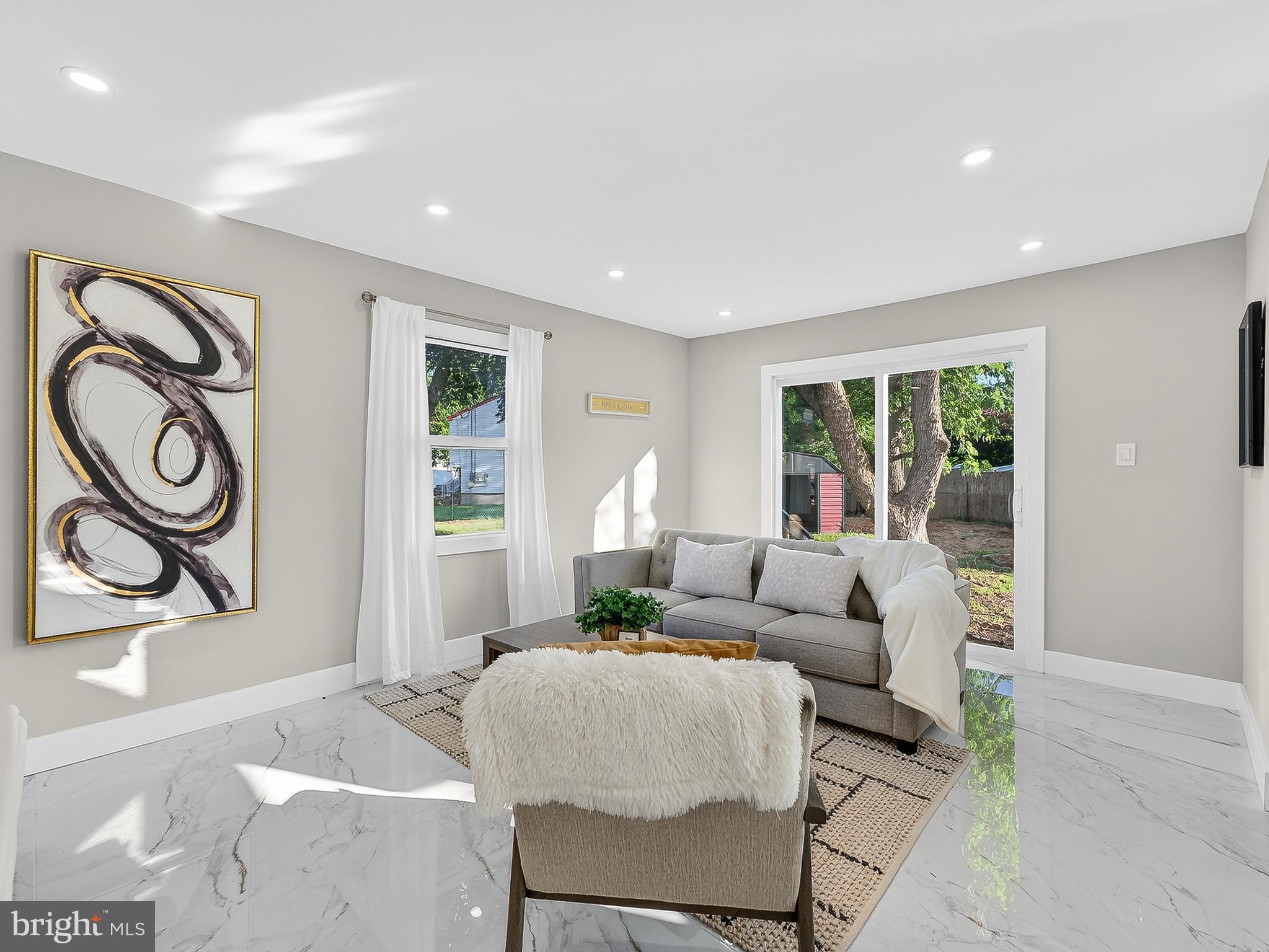 16 Estate Road Pemberton, NJ 08068 - Photo 17 of 40 a living room with furniture and a large window