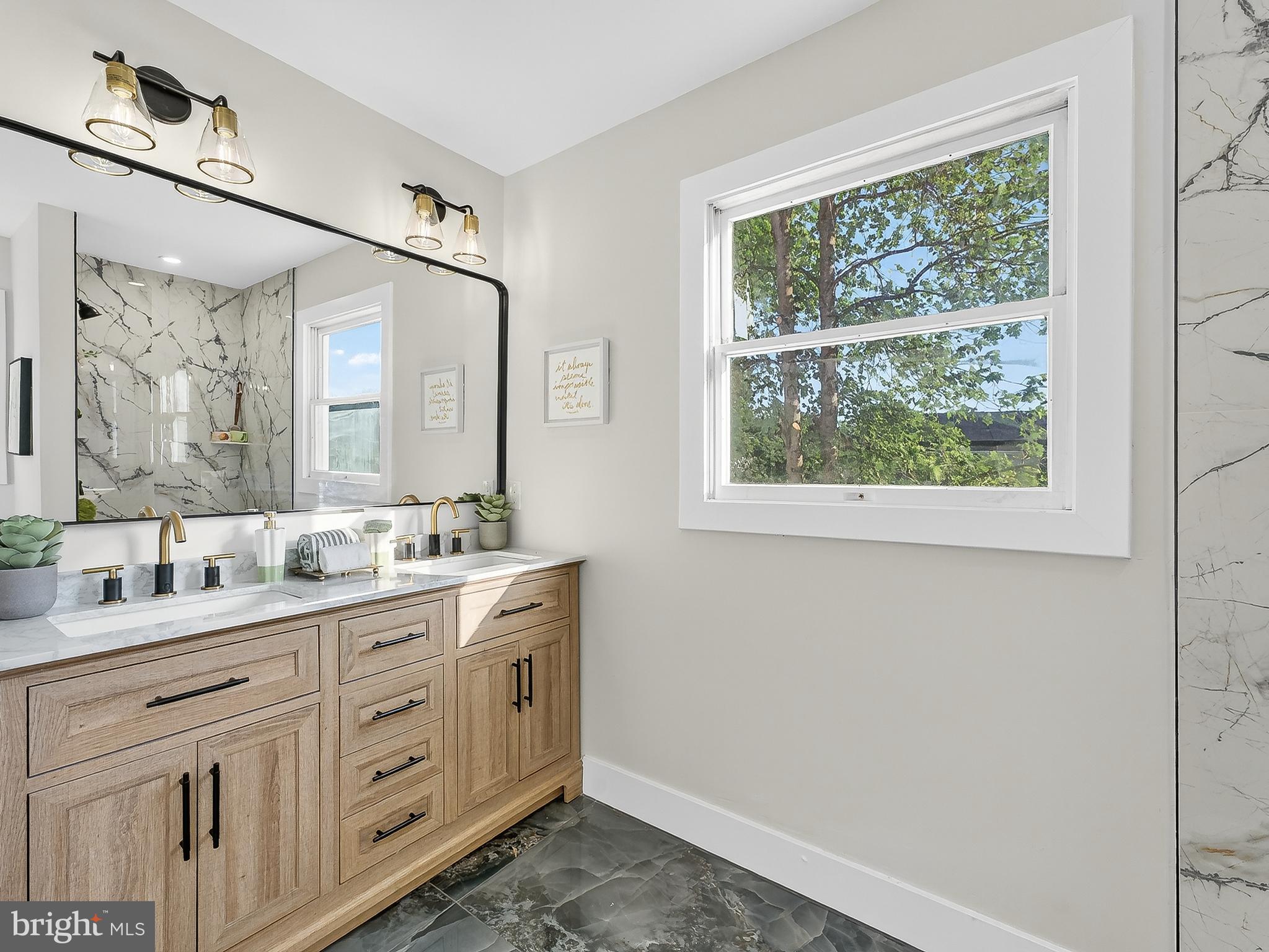 16 Estate Road Pemberton, NJ 08068 - Photo 27 of 40 a bathroom with a double vanity sink and mirror with window