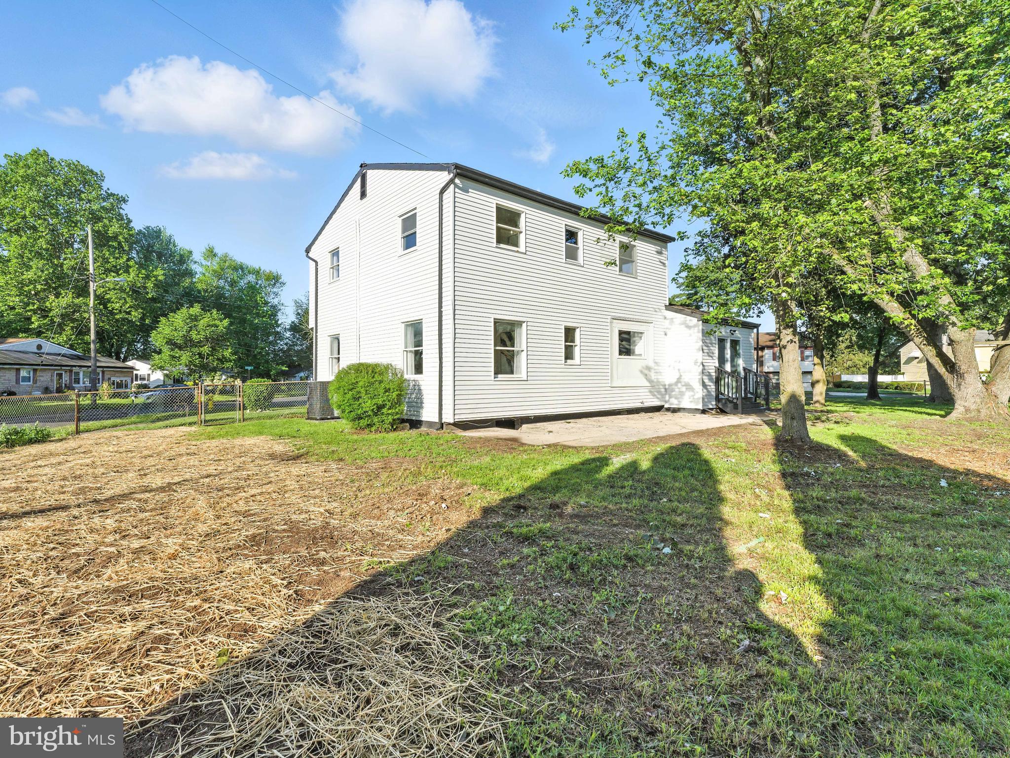 16 Estate Road Pemberton, NJ 08068 - Photo 38 of 40 a view of a white house with yard and plants