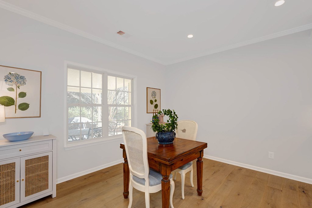 6712 Bridge Way Columbus, GA 31904 - Photo 14 of 36 a dining room with furniture a window and wooden floor