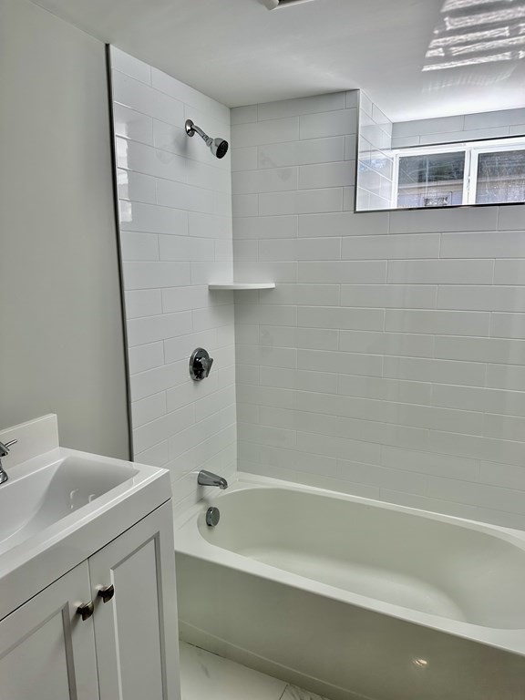 102 Beaconsfield Road Worcester, MA 01602 - Photo 27 of 34 a bathroom with a bathtub and a sink