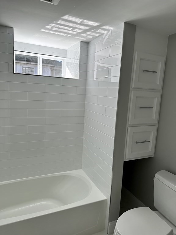 102 Beaconsfield Road Worcester, MA 01602 - Photo 6 of 34 a bathroom with a toilet and a shower