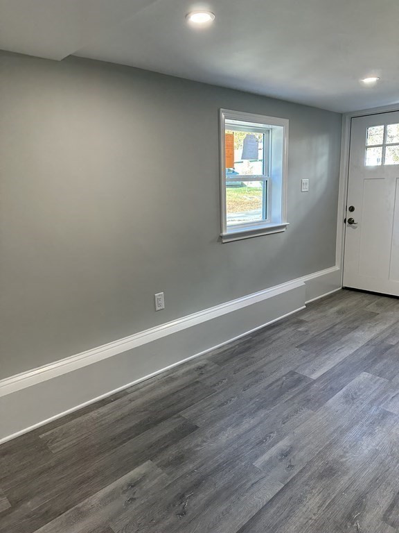 102 Beaconsfield Road Worcester, MA 01602 - Photo 8 of 34 an empty room with wooden floor and windows