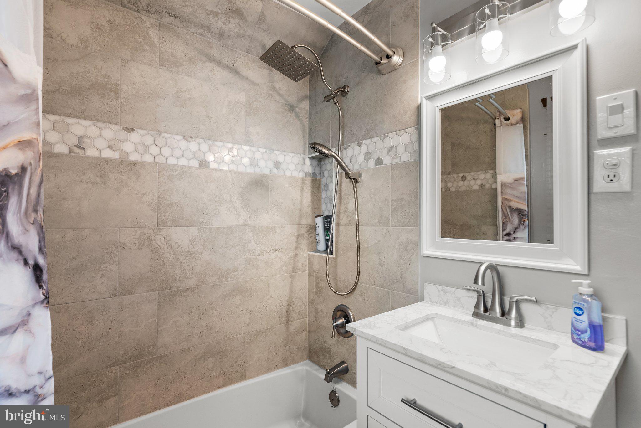 1013 Carson Street Silver Spring, MD 20901 - Photo 13 of 20 a bathroom with a sink vanity granite tub and shower