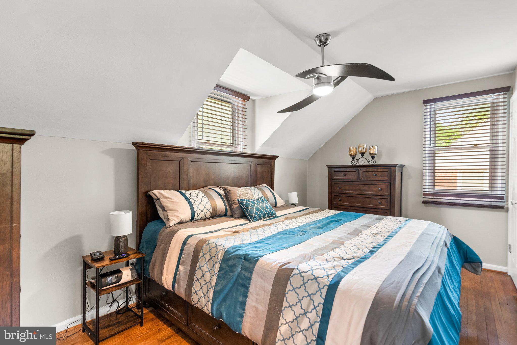 1013 Carson Street Silver Spring, MD 20901 - Photo 15 of 20 a bedroom with a bed and a chandelier