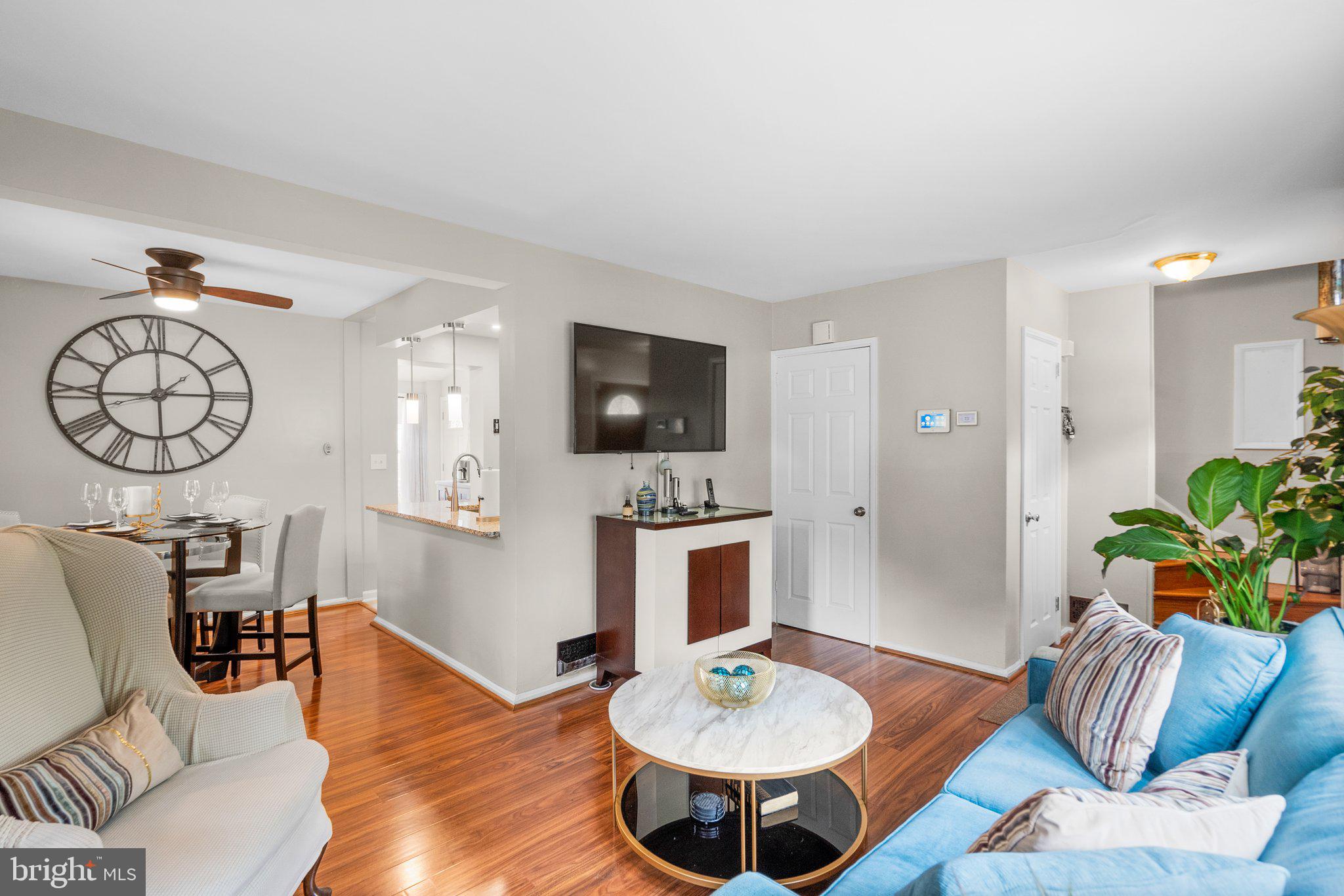 1013 Carson Street Silver Spring, MD 20901 - Photo 5 of 20 a living room with furniture a fireplace and a table