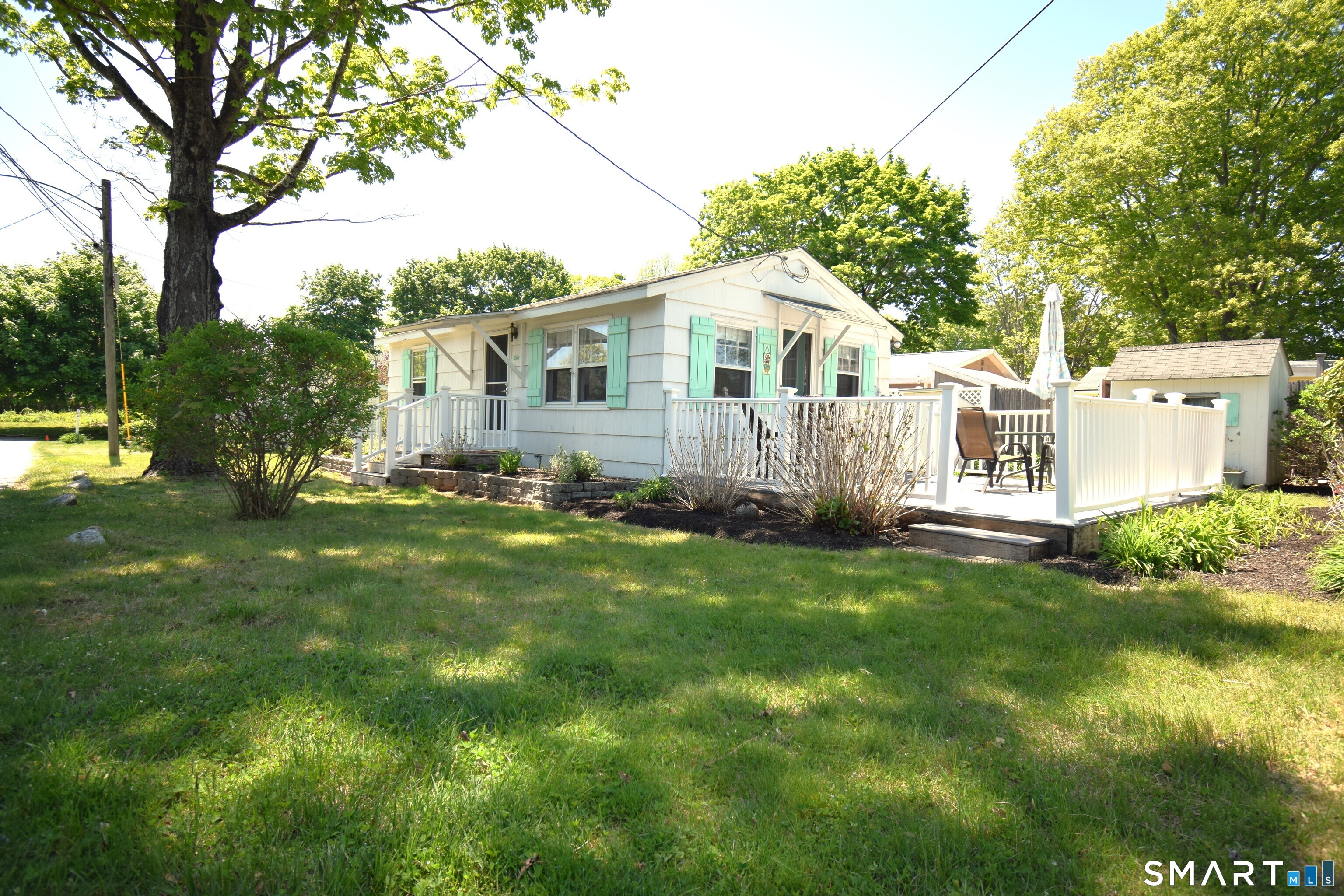 50 East Street Madison, CT 06443 - Photo 21 of 26 a front view of a house with garden