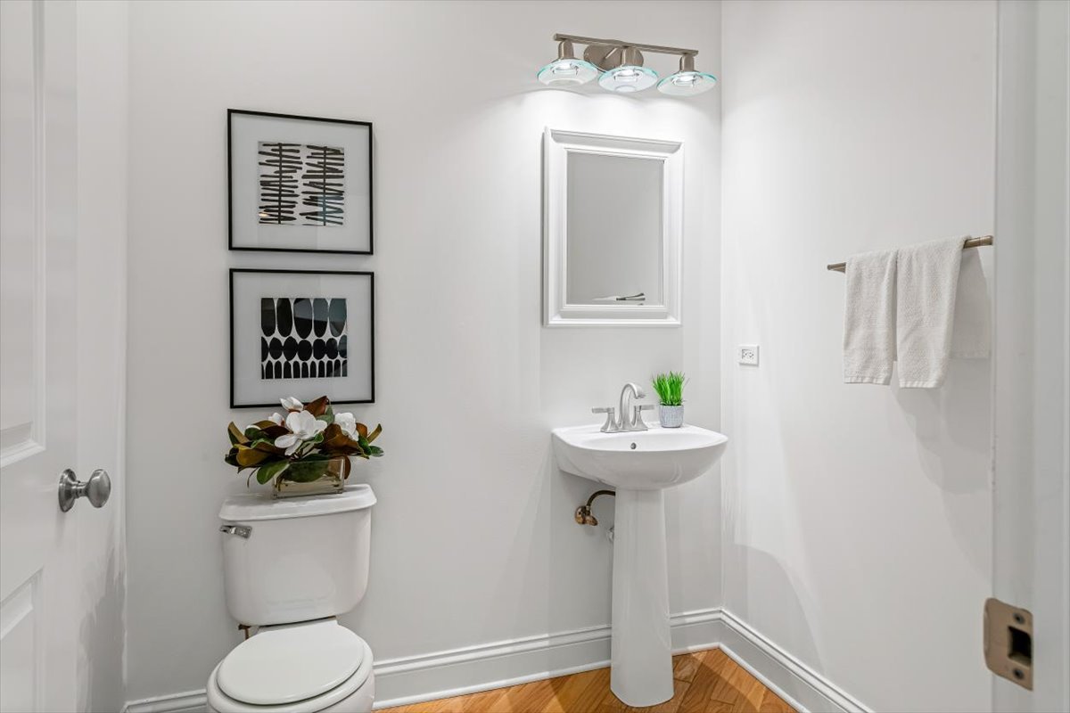 45 Prairie Park Drive, Unit 501 Wheeling, IL 60090 - Photo 17 of 30 a bathroom with a toilet sink and mirror