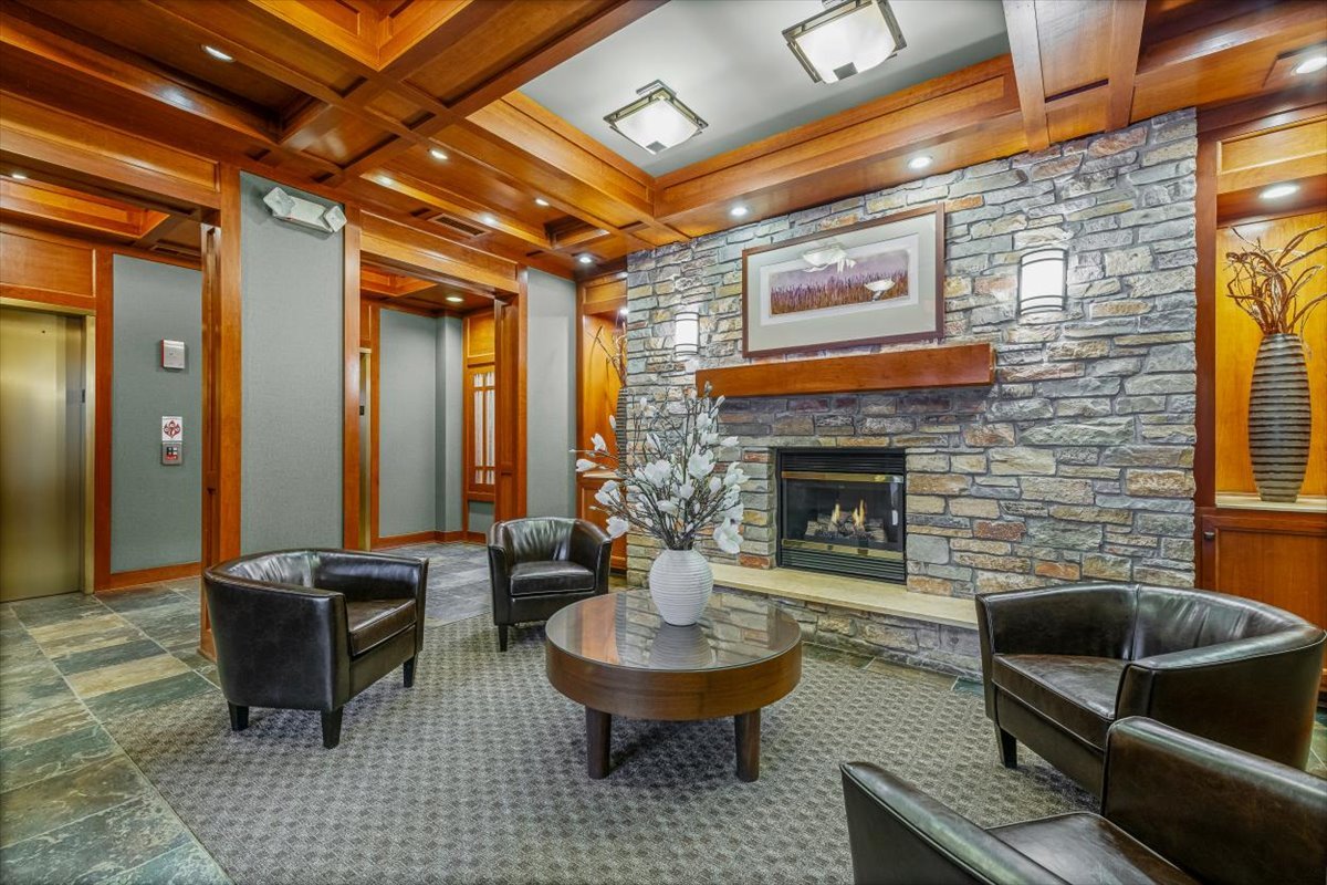 45 Prairie Park Drive, Unit 501 Wheeling, IL 60090 - Photo 4 of 30 a living room with furniture and a fireplace