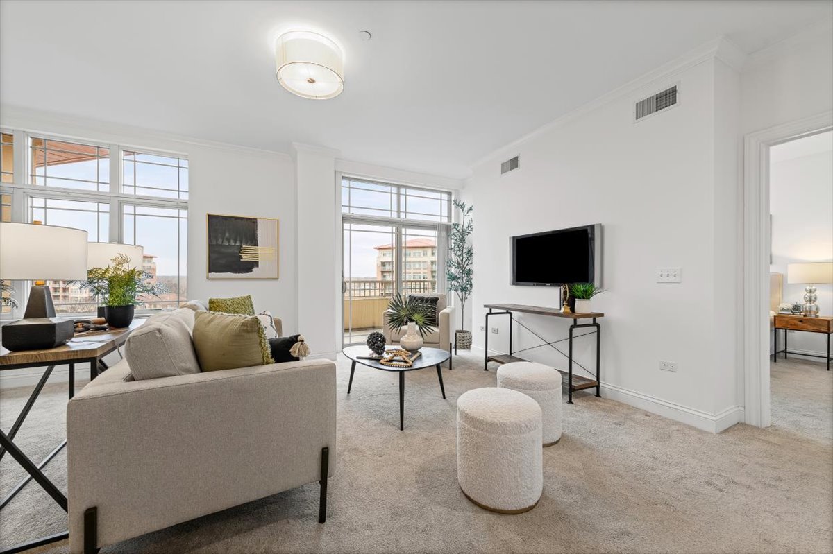 45 Prairie Park Drive, Unit 501 Wheeling, IL 60090 - Photo 5 of 30 a living room with furniture and a flat screen tv